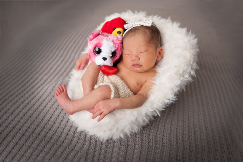 Stouffville Ontario Hark Nijjar Photography Studio newborn professional  photoshoot in fluffy chair